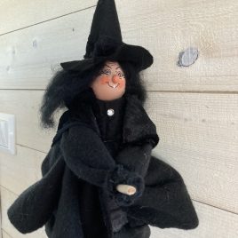 Kitchen witch on broom